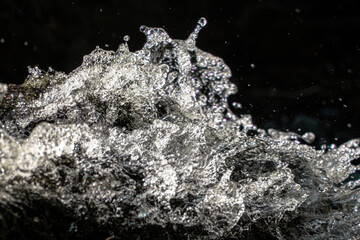 Waterfall splash macro. Water texture background. Fresh liquid motion. Frozen droplet spray. Cascading stream foam. High speed aqua shot. Dynamic wave action. Pure fluid splash. Crystal clear droplets © Kara
