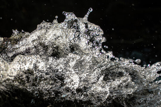 Waterfall splash macro. Water texture background. Fresh liquid motion. Frozen droplet spray. Cascading stream foam. High speed aqua shot. Dynamic wave action. Pure fluid splash. Crystal clear droplets