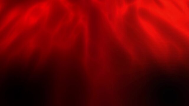 Dark abstract video loop featuring smooth red smoke waves, atmospheric fire fog, and glowing light movement for ambient video backdrops.