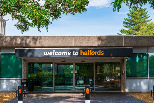 Redditch, Worcestershire, UK - August 14 2026: External signage of Halfords head office stating "Welcome to Halfords"