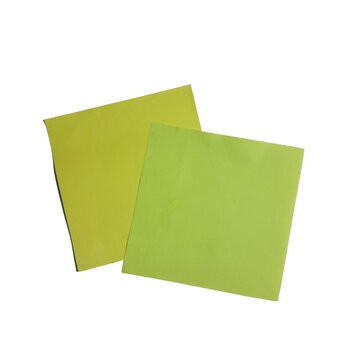 Two overlapping yellow sticky notes on a black background simple office supplies