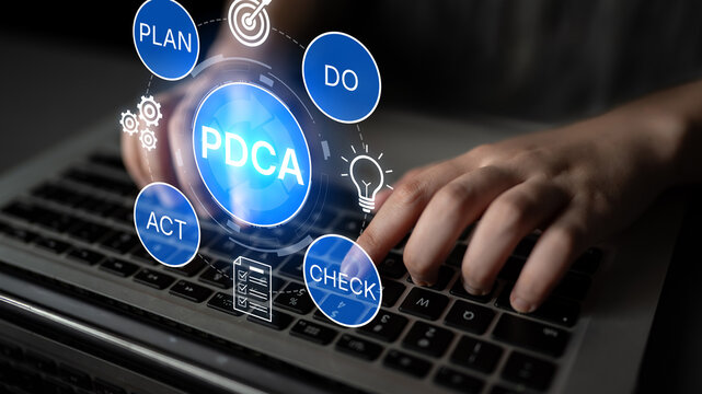 Innovative Business Strategy Using PDCA Cycle with Hands on Laptop Keyboard and Icons Representing Plan, Do, Check, Act in Digital Environment. Bitwise.