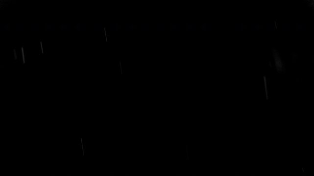 Super slow motion of natural rain drops falling on black background