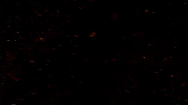 Flying Sparks Isolated on Black Background. Filmed on High Speed Cinema Camera