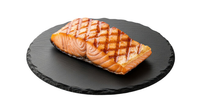 Seared salmon fillet with cross hatch grill marks on black slate plate