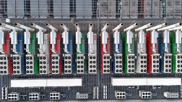 Aerial view of Keppel Data Center Reit featuring rows of colorful industrial cooling units and ventilation fans on a flat roof in Offenbach am Main, Hessen, Germany.