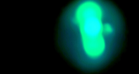 Naklejka premium Neon Green Cyan Light Leak on Dark Black Background with Soft Gradient Glow, Grainy Noise Texture, Blurred Abstract Illumination and Modern Atmospheric Design