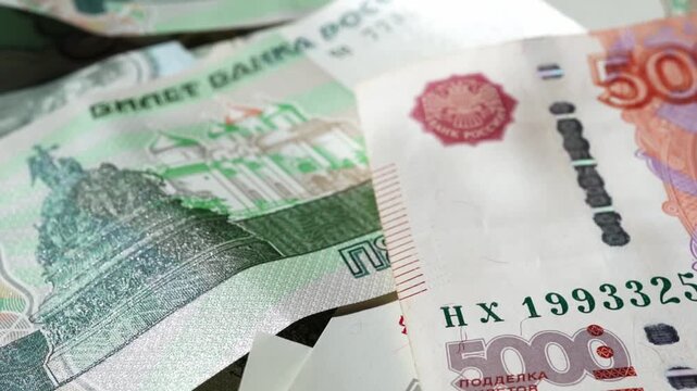 Paper banknotes of Russian rubles of different denominations in a stack close-up