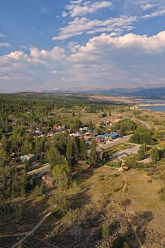 Aerial view of Twin Lakes surrounded by lush forests, winding roads, and mountain vistas in Twin Lakes, Colorado, United States.