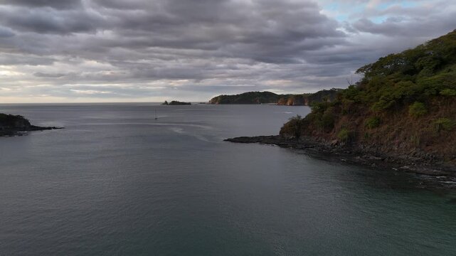 Aerial Drone View of tropical Playa Penca Bay and Rocky Coast, Costa Rica 4K
