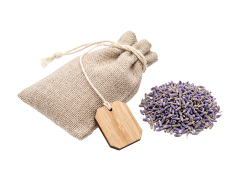 Dried lavender sachet bag pouch with wooden tag for home fragrance aromatherapy concept, isolated on black background for organic wellness, spa product mockup, herbal bath relaxation and scent packagi