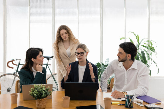 Business people collaborating on creative corporate strategy in office