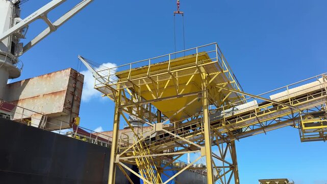 discharging grain cargo from ship to silo hopper with conveyor belt