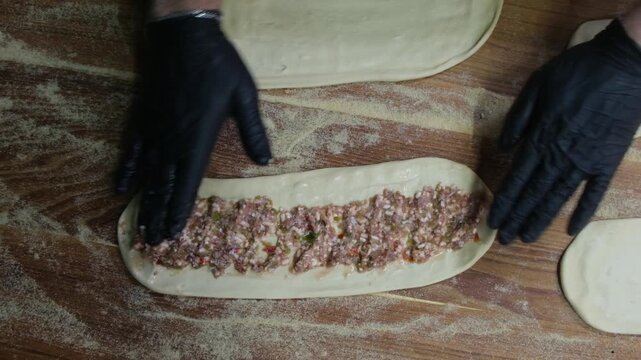 Slow motion preparation of traditional meat flatbread