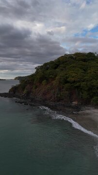 Aerial Drone View of Playa Penca Rocky Beach and Tropical Coast, Costa Rica &ndash; 4K