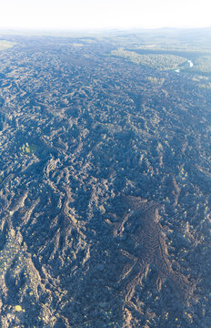 A bird's eye view of an ancient lava field shows an extremely rugged and inhospitable landscape near Bend, Oregon. This vast area is part of the volcanic Cascade Mountain Range.