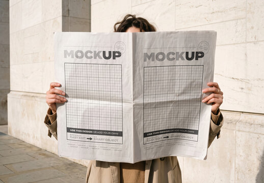 Person Holding Open Newspaper Cover and Back Mockup