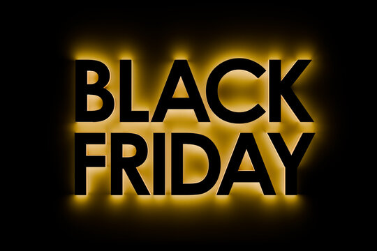 "Black Friday" text in 3d black on black with yellow glow around. Pure black around for easy expandability