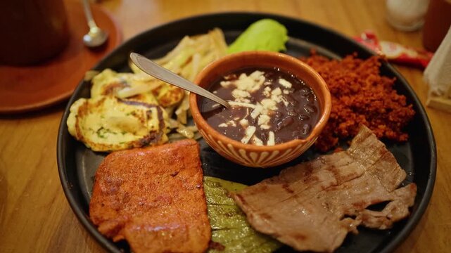 Traditional Mexican Mixed Breakfast Plate With Chorizo Eggs Beans And Cheese