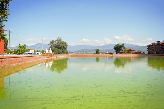 Green Waters of Siddha Pokhari with Mountain View in Bhaktapur Nepal