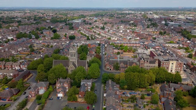 Wide drone descent approaching Saint Paul's Church in Burton