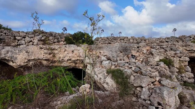Malta, Xemxija Heritage trail - Entrance of the Punic caves near old farmers hut.