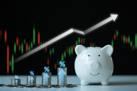 Interest rate and dividend concept. Business stacking coins money with up arrow and percentage symbol for financial banking increase interest rate or mortgage investment dividend business growth.