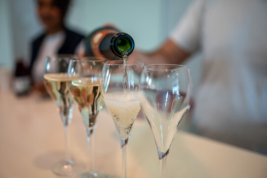 Tasting sparkling wine in Champagne cellars in Epernay, wine tour, visit cellars, Champagne, France.