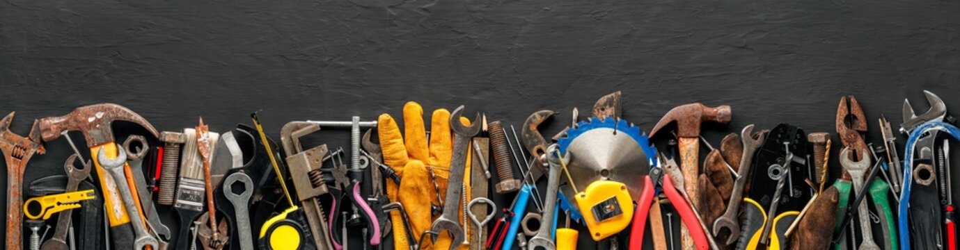 Group of worn work tools. Collection of used blue collar work equipment. For home improvement, diy repair projects, manual labor jobs, Father's day gift ideas, or to celebrate Labor Day.