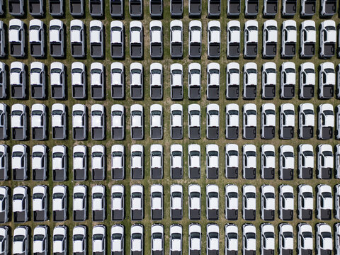 Aerial view of rows of white pickup trucks parked in a car factory lot in San Luis Potosi, San Luis Potosi, Mexico.