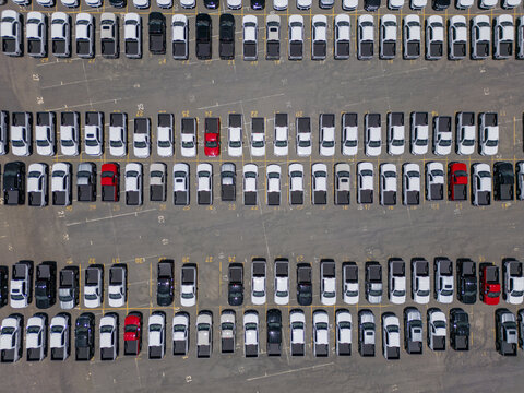 Aerial view of a car factory parking lot filled with rows of new pickup trucks in San Luis Potosi, San Luis Potosi, Mexico.