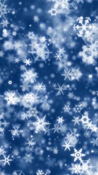 Winter scene of glowing snowflakes sparkling on blue background. Snowflake backgrounds with twinkling snow flakes creating cold wintry atmosphere. Soft snowflakes for winter or Christmas background.