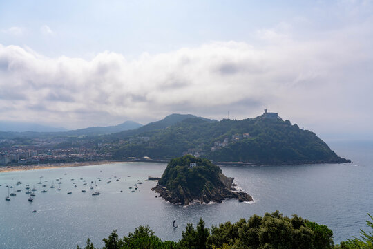 Santa Klara Island and Sail Boats Anchored in the Bay in San Sebastian  Spain