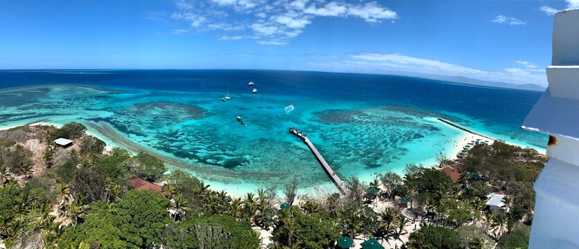 Panoramic high angle view of tropical turquoise ocean lagoon and coral reef in New Caledonia