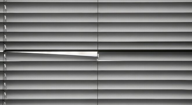 Close up view of horizontal metal window blinds.