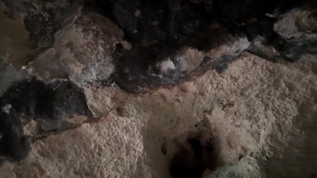 Malta, Xemxija Heritage trail, Punic caves interior. Holes in the ceiling used to tie something.