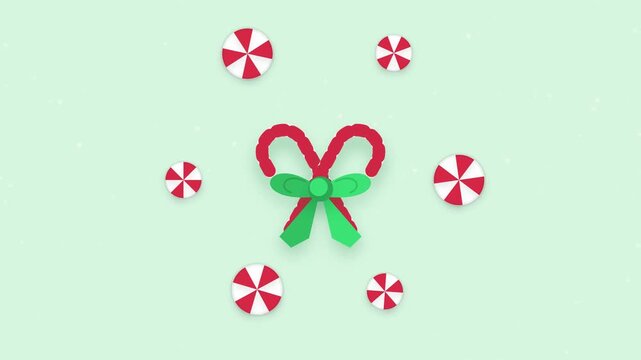 Festive Peppermint Candy Canes Spinning with Falling Snowflakes Holiday Season Motion Graphic