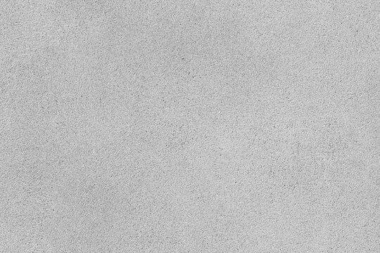 Concrete wall - light gray stucco seamless background texture. Cement textured floor surface.