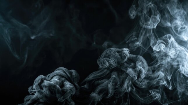 Dark smoke swirls and drifts across a black background. The smoke forms intricate, flowing shapes and patterns, creating a dramatic and ethereal atmosphere.