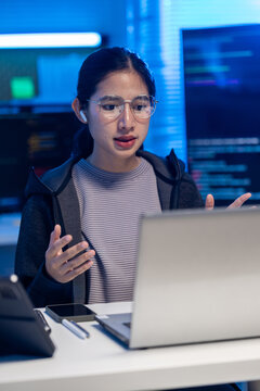 Woman laptop office technology headset glasses computer workspace communication professional Vertical
