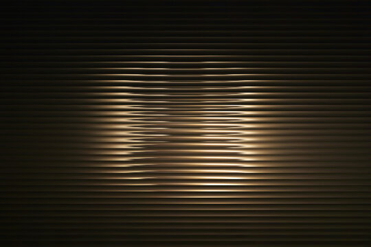 Abstract dark background with wavy horizontal metallic lines and a soft central light glow