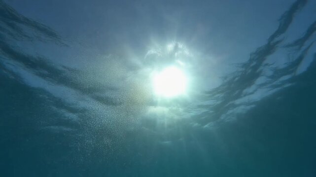 Sunlight rays and bubbles rising from the ocean floor mauritius