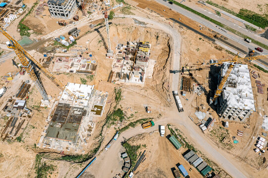construction site view from above. residential houses at a different stage of construction. aerial drone photo.