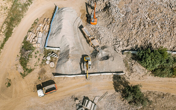 heavy industrial machines for production of gravel for construction works. aerial top view.