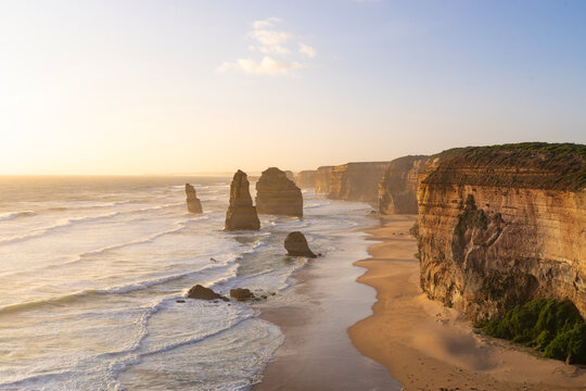 Stunning sunset view of the Twelve Apostles limestone stacks and rugged cliffs along the Great Ocean Road in Victoria, Australia
