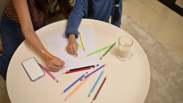 Creative Drawing Time: Child and Parent Enjoying Art Together