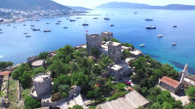 Aerial Bodrum Castle above marina and sea boats on Turkeys Aegean and Mediterranean coast.