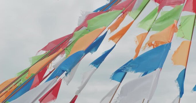 Colorful prayer flags fluttering in wind on Inner Mongolia grassland