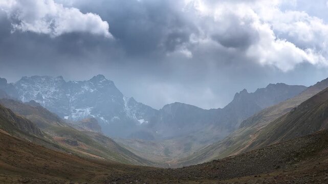 Kackar Mountains Rize Turkey U shaped valley sits below rocky peaks and green meadows.