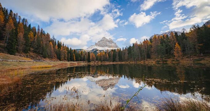 Scenic Autumn Landscape of Lake Antorno with Mountain Peak Reflection and Golden Larch Trees, Dolomites